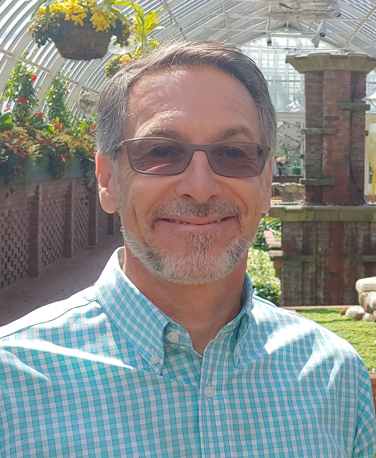 A man smiles at the camera